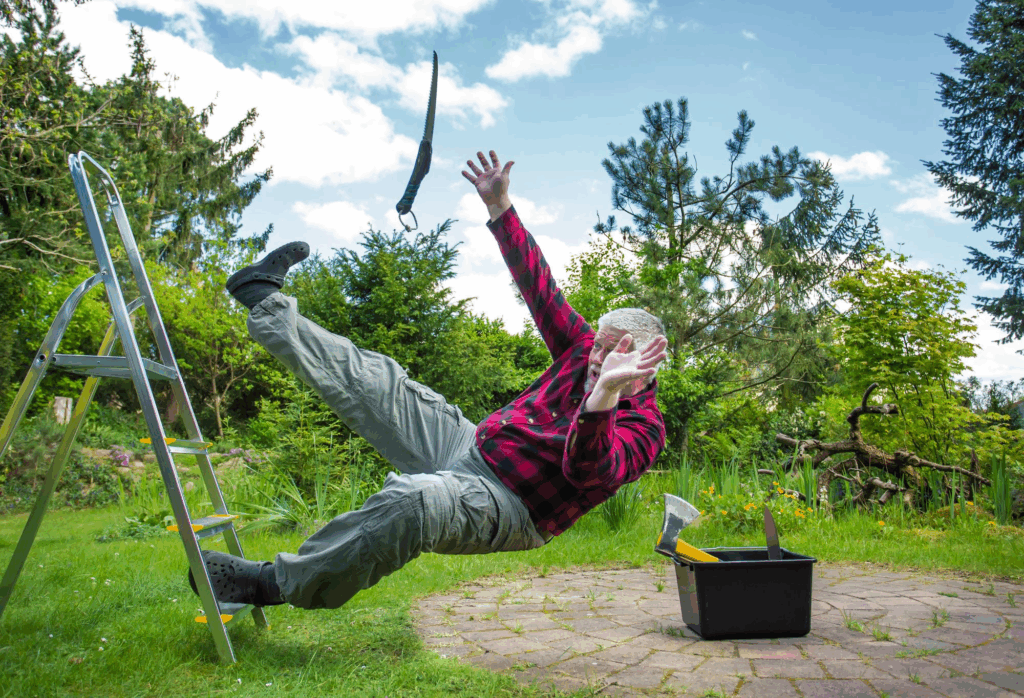 Man falling from a ladder in a yard, representing a premises liability or catastrophic injury event.