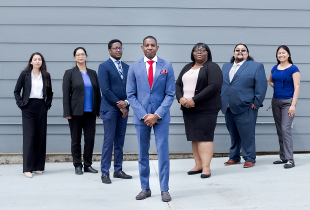 The legal team at The Tyson Law Firm standing together in professional attire.